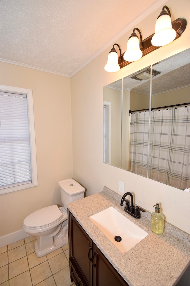 bathroom featuring tile patterned flooring, vanity, toilet, crown molding, and a textured ceiling