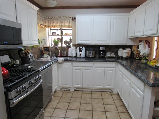 kitchen featuring white cabinets, light tile patterned flooring, and stainless steel appliances