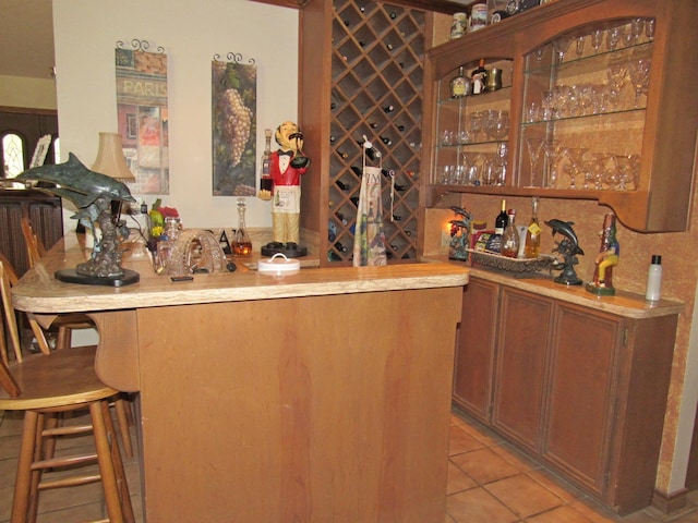 bar with light tile patterned floors