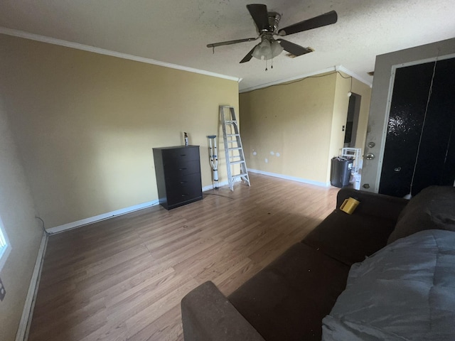2007 Queen Ave, Nederland, TX 77627 - living room with wood finished floors, ceiling fan, and crown molding