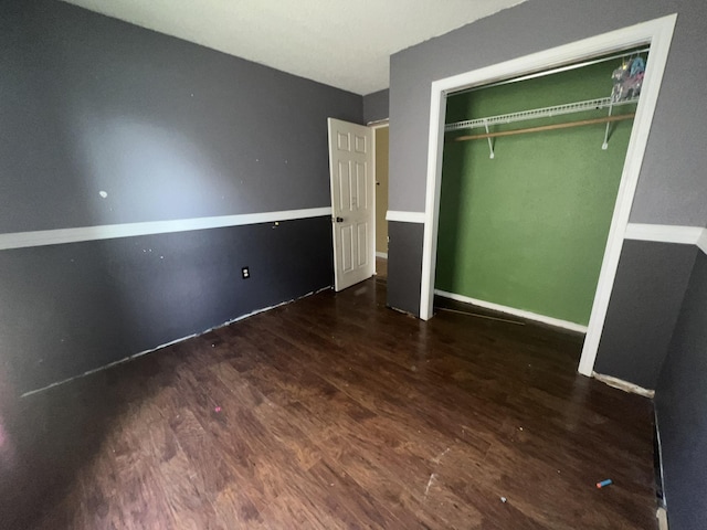 2007 Queen Ave, Nederland, TX 77627 - unfurnished bedroom featuring wood finished floors and a closet