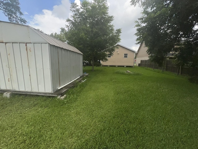 2007 Queen Ave, Nederland, TX 77627 - view of yard featuring a storage shed