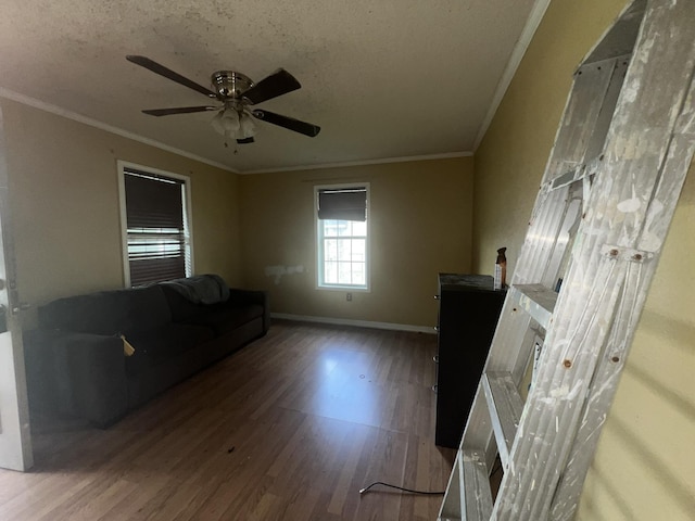 2007 Queen Ave, Nederland, TX 77627 - living room featuring wood finished floors, a ceiling fan, crown molding, and a textured ceiling