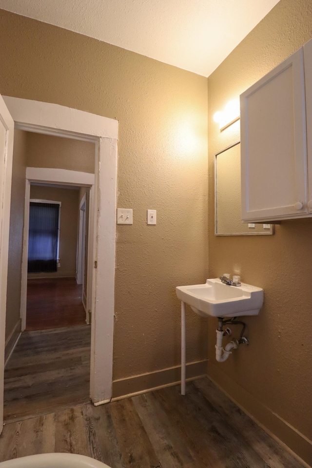 bathroom featuring sink and wood-type flooring