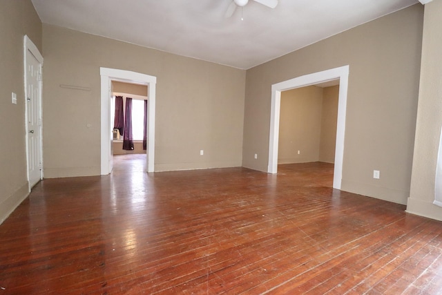 unfurnished room featuring ceiling fan and hardwood / wood-style floors