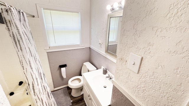 3575 Cecil Dr, Beaumont, TX 77706 - full bathroom with wood finished floors, a textured wall, vanity, and shower / bath combination with curtain