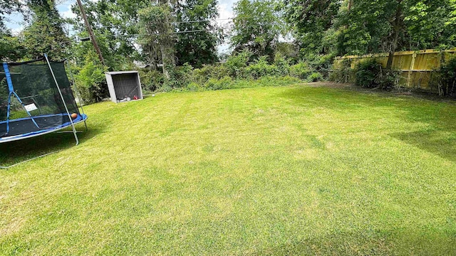 3575 Cecil Dr, Beaumont, TX 77706 - view of yard featuring a trampoline