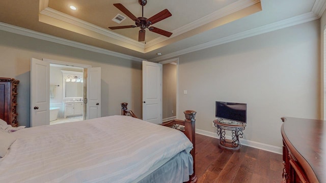 6570 Merrick Ln, Beaumont, TX 77706 - bedroom with a raised ceiling, dark wood finished floors, crown molding, connected bathroom, and recessed lighting