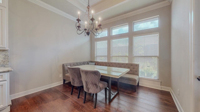6570 Merrick Ln, Beaumont, TX 77706 - dining area with dark wood-type flooring, crown molding, plenty of natural light, and a chandelier