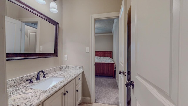 6570 Merrick Ln, Beaumont, TX 77706 - bathroom featuring vanity, ornamental molding, and ensuite bath