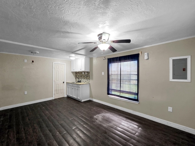 9570 Cumberland Dr, Beaumont, TX 77708 - unfurnished living room featuring dark wood-style floors, a textured ceiling, a ceiling fan, and electric panel