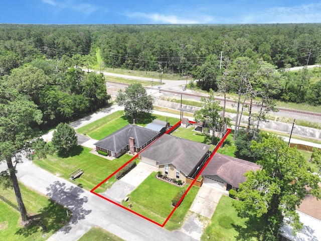 9570 Cumberland Dr, Beaumont, TX 77708 - aerial view of property's location featuring a forest and property boundaries highlighted