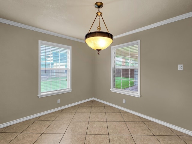 9570 Cumberland Dr, Beaumont, TX 77708 - spare room with healthy amount of natural light, light tile patterned flooring, and crown molding