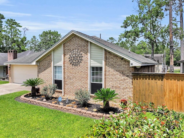 9570 Cumberland Dr, Beaumont, TX 77708 - view of home's exterior featuring brick siding, an attached garage, concrete driveway, and a shingled roof