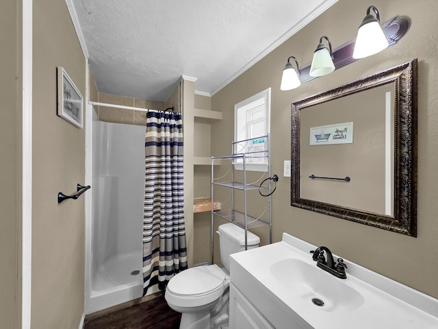 9570 Cumberland Dr, Beaumont, TX 77708 - full bath with a stall shower, ornamental molding, vanity, a textured ceiling, and wood finished floors