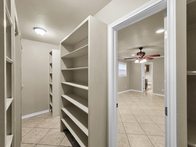 9570 Cumberland Dr, Beaumont, TX 77708 - spacious closet with light tile patterned flooring and ceiling fan