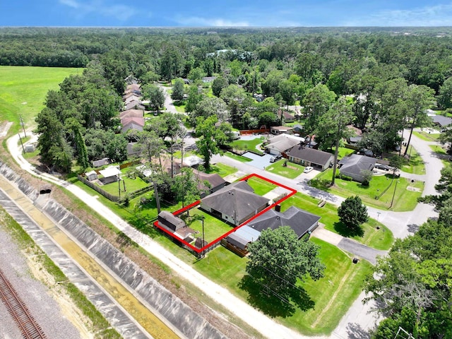 9570 Cumberland Dr, Beaumont, TX 77708 - aerial perspective of suburban area featuring property parcel outlined and a heavily wooded area