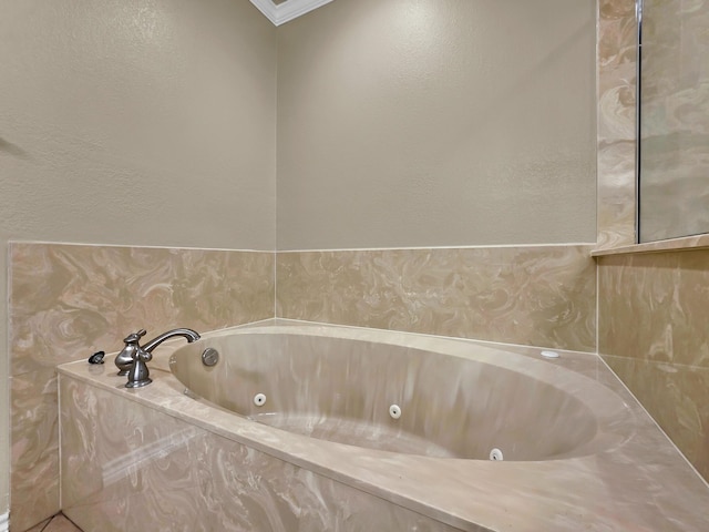 9570 Cumberland Dr, Beaumont, TX 77708 - full bathroom featuring a jetted tub and crown molding