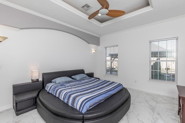 bedroom featuring marble finish floor, visible vents, a tray ceiling, and baseboards