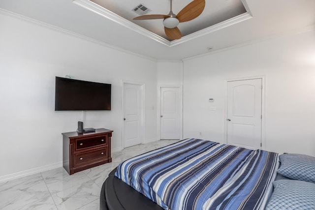 bedroom with visible vents, baseboards, marble finish floor, a tray ceiling, and crown molding