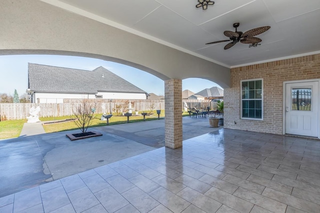 view of patio / terrace with outdoor dining space, fence private yard, and a ceiling fan