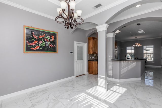 interior space with arched walkways, a chandelier, visible vents, baseboards, and marble finish floor