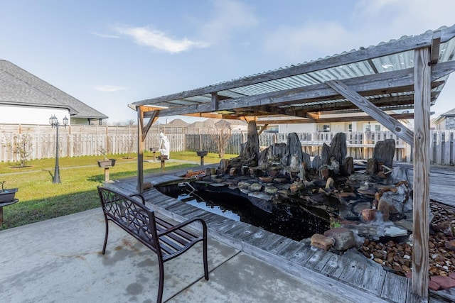 view of patio featuring fence