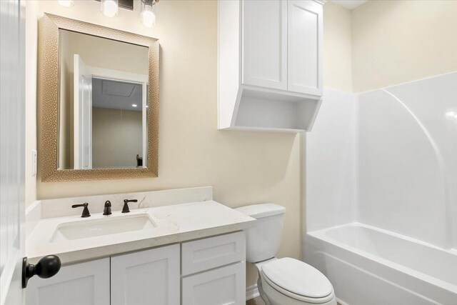 full bathroom featuring vanity, toilet, and bathing tub / shower combination