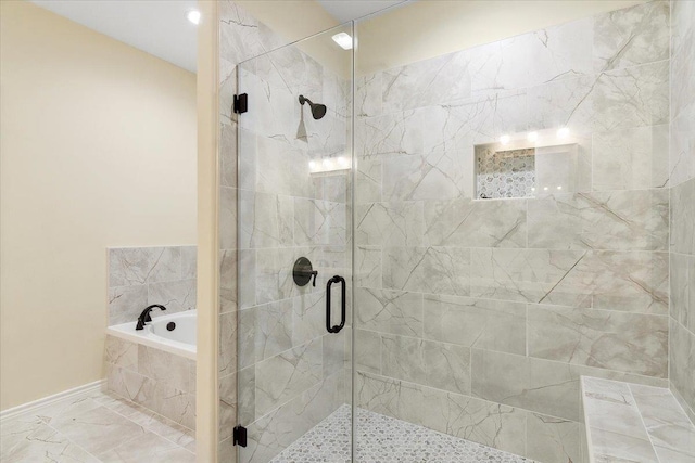 bathroom with shower with separate bathtub