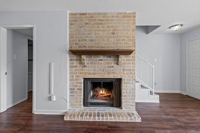 1003 Park Mdw, Beaumont, TX 77706 - detailed view of wood finished floors, a fireplace, and baseboards