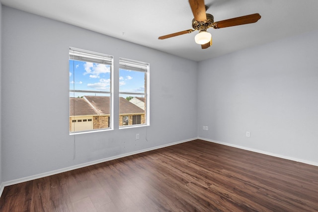 1003 Park Mdw, Beaumont, TX 77706 - unfurnished room with dark wood-style flooring, baseboards, and ceiling fan
