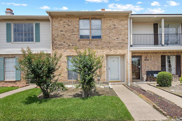 1003 Park Mdw, Beaumont, TX 77706 - view of property with a balcony and brick siding