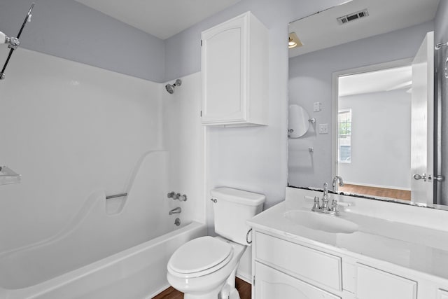 1003 Park Mdw, Beaumont, TX 77706 - bathroom featuring wood finished floors, bathing tub / shower combination, toilet, and vanity