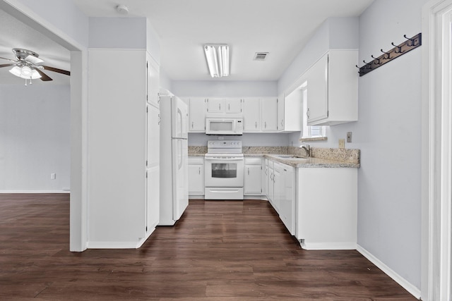 1003 Park Mdw, Beaumont, TX 77706 - kitchen featuring white appliances, a ceiling fan, baseboards, white cabinets, and a sink