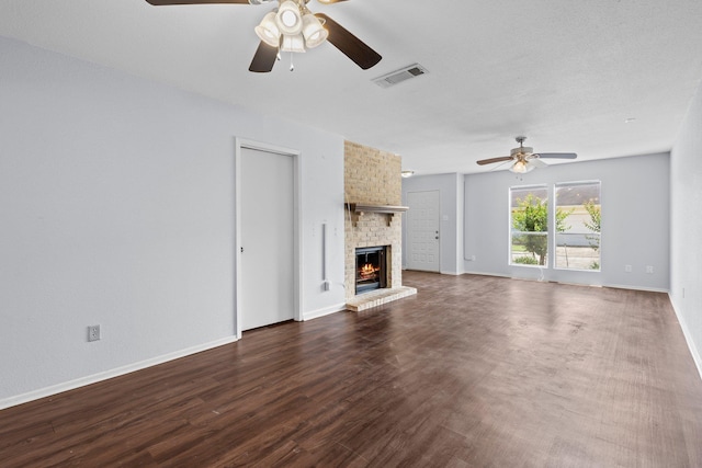 1003 Park Mdw, Beaumont, TX 77706 - unfurnished living room with a ceiling fan, a fireplace, dark wood-type flooring, and baseboards