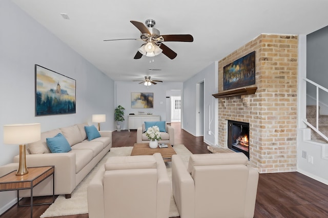 1003 Park Mdw, Beaumont, TX 77706 - living area featuring dark wood finished floors, a brick fireplace, and a ceiling fan