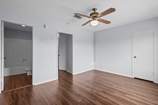 1003 Park Mdw, Beaumont, TX 77706 - unfurnished bedroom with wood finished floors, ensuite bath, baseboards, a spacious closet, and ceiling fan