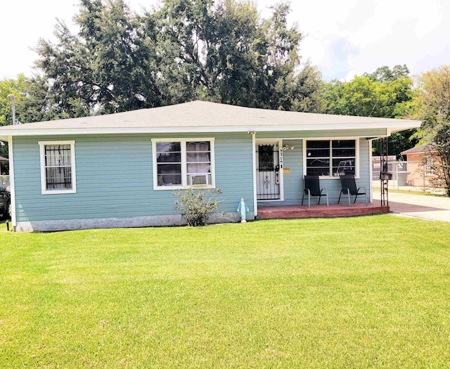 2210 Nora St, Beaumont, TX 77705 - view of front of house featuring a porch and a front yard