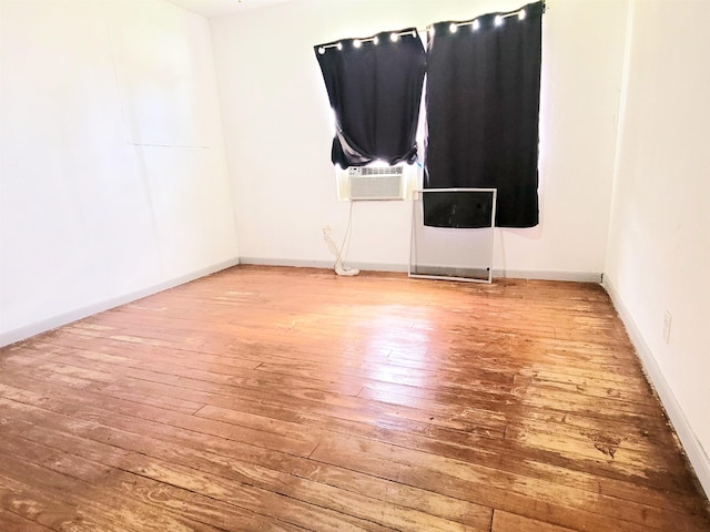 2210 Nora St, Beaumont, TX 77705 - unfurnished room with wood-type flooring and cooling unit