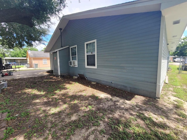2210 Nora St, Beaumont, TX 77705 - view of side of home featuring cooling unit
