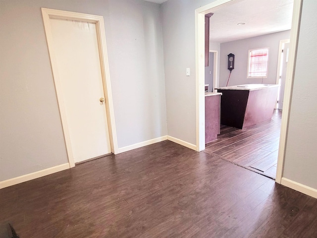 2210 Nora St, Beaumont, TX 77705 - unfurnished room with dark wood-type flooring and baseboards