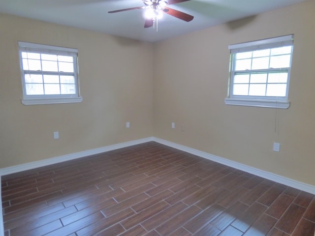 5335 Idylwood St, Beaumont, TX 77703 - spare room featuring a ceiling fan, dark wood-type flooring, and baseboards