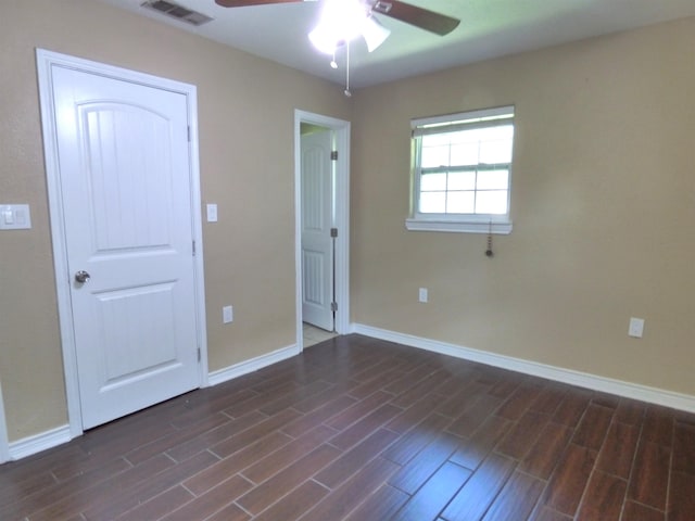 5335 Idylwood St, Beaumont, TX 77703 - unfurnished bedroom featuring baseboards, dark wood-style floors, and ceiling fan