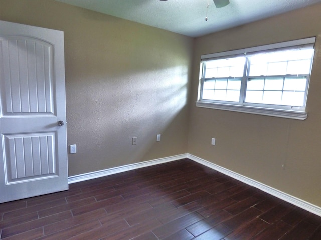 5335 Idylwood St, Beaumont, TX 77703 - spare room with baseboards, dark wood finished floors, and ceiling fan