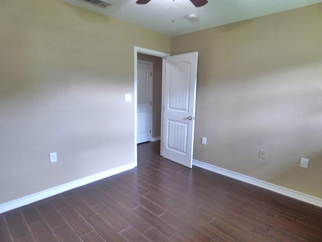 5335 Idylwood St, Beaumont, TX 77703 - spare room featuring baseboards, ceiling fan, dark wood-style floors, and a smoke detector