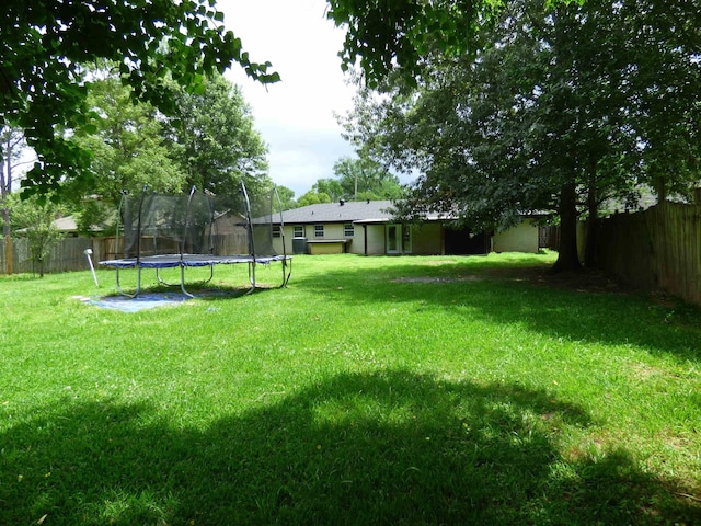 5335 Idylwood St, Beaumont, TX 77703 - view of yard with a trampoline
