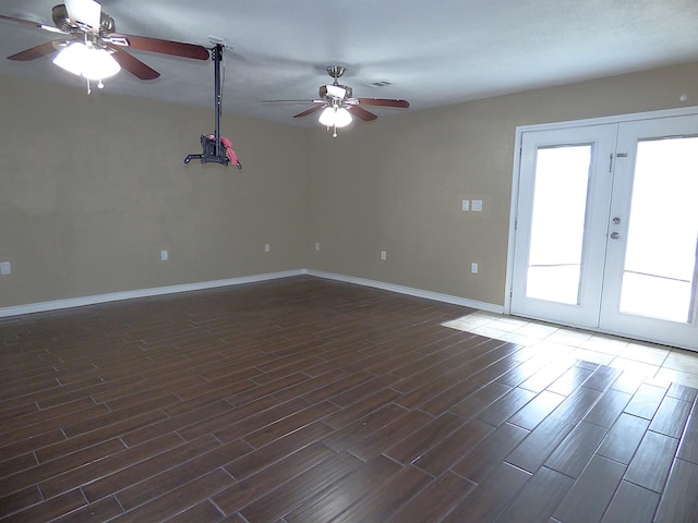 5335 Idylwood St, Beaumont, TX 77703 - unfurnished room featuring a ceiling fan, dark wood-style flooring, baseboards, and french doors