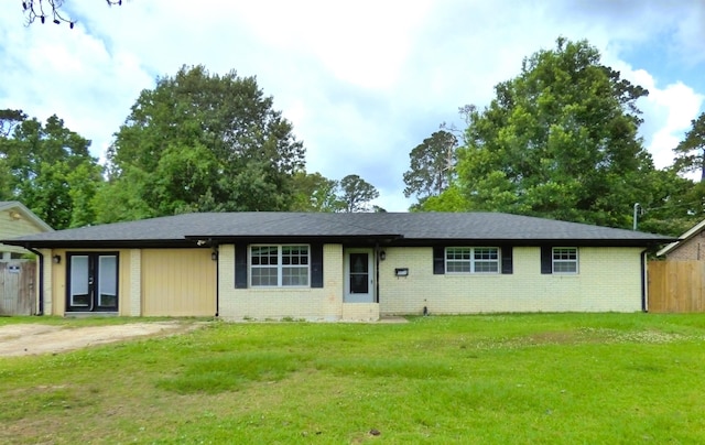 5335 Idylwood St, Beaumont, TX 77703 - ranch-style house with brick siding and french doors