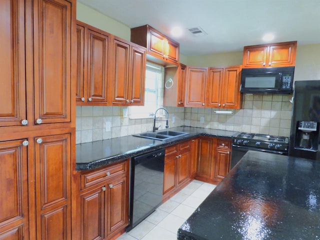 5335 Idylwood St, Beaumont, TX 77703 - kitchen featuring black appliances, a sink, decorative backsplash, and brown cabinets