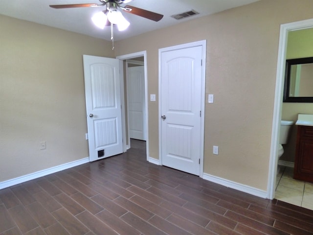 5335 Idylwood St, Beaumont, TX 77703 - unfurnished bedroom featuring wood finished floors, baseboards, ensuite bathroom, and ceiling fan
